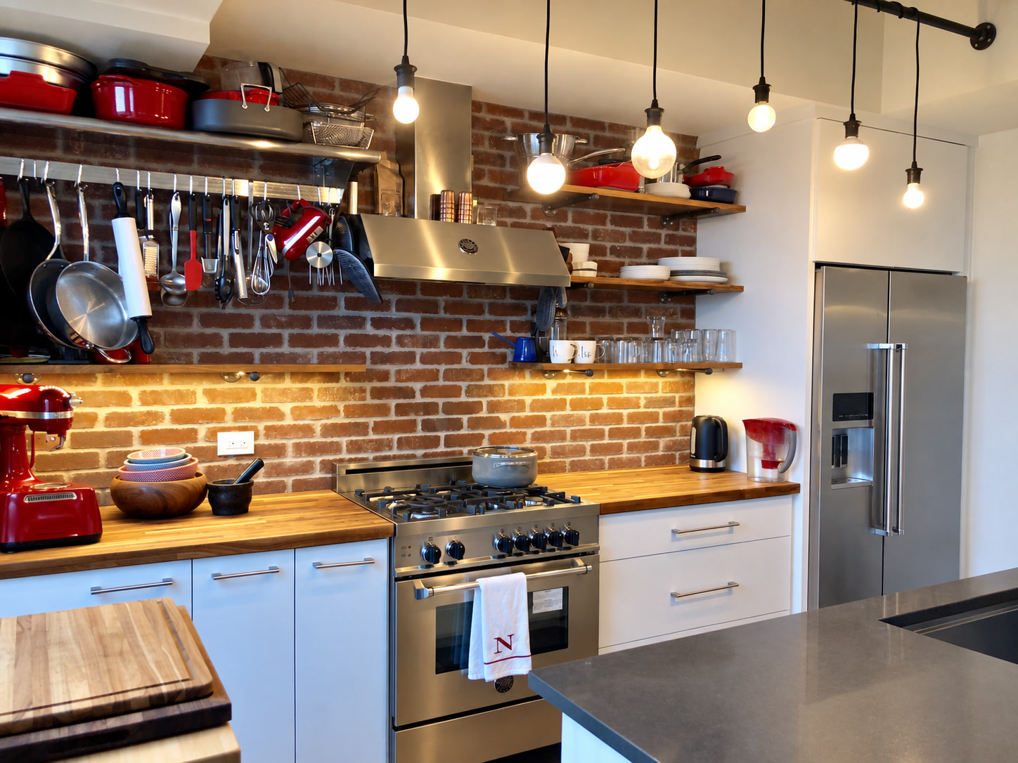 Kitchen with exposed brick backsplash, open wood shelves and stainless steel range