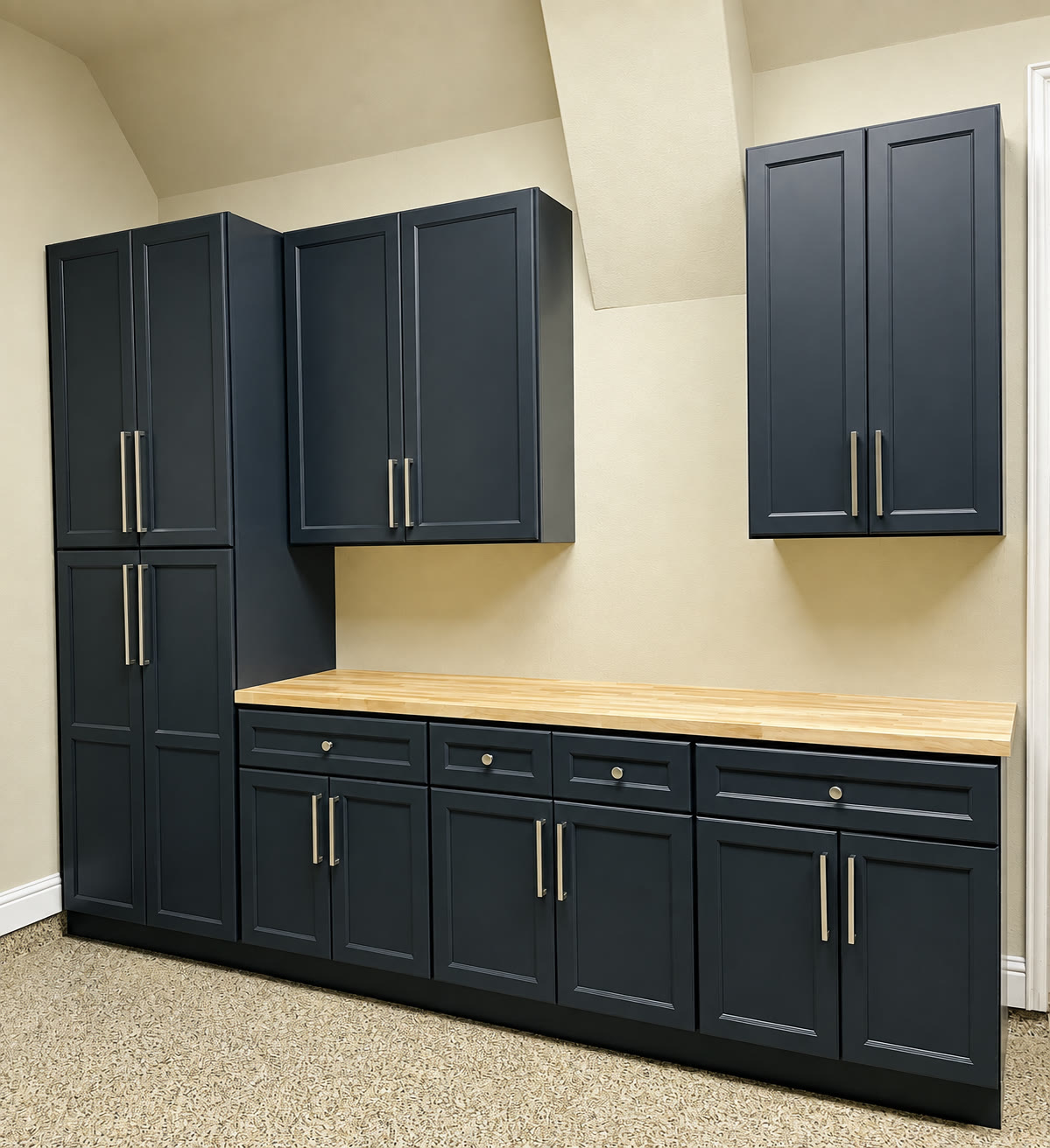 Utility room with dark blue cabinetry, a butcher-block counter and speckled floor