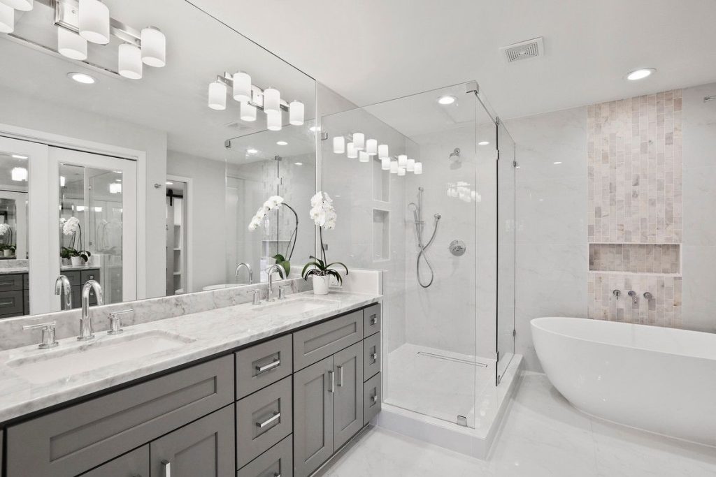 Bright bathroom with freestanding tub and double vanity