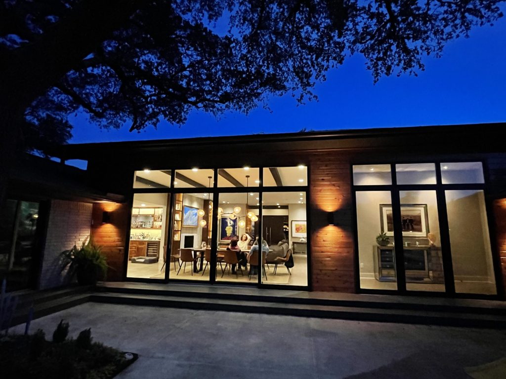 Modern residence with expansive glass opening to a garden