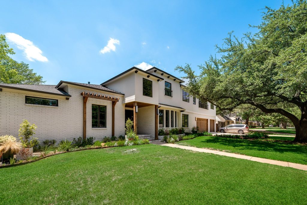 Remodeled Dallas home with stone path and landscaped lawn