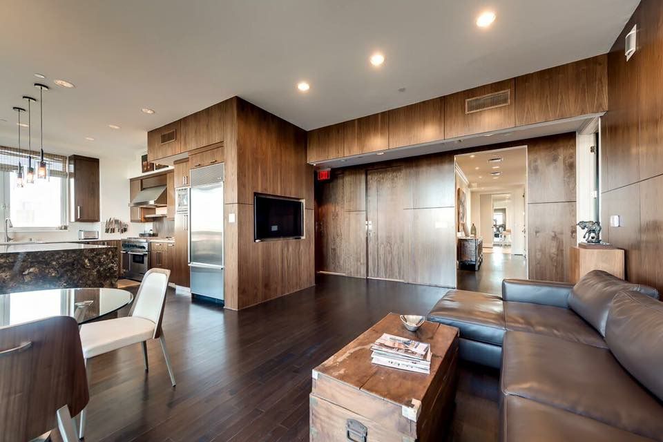 Open living space with wood finishes and fireplace