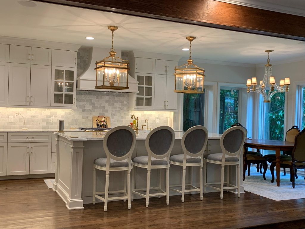 Kitchen with marble island and pendant lighting