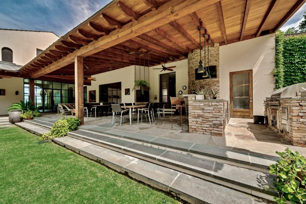 Outdoor room with timber ceiling and stone floor