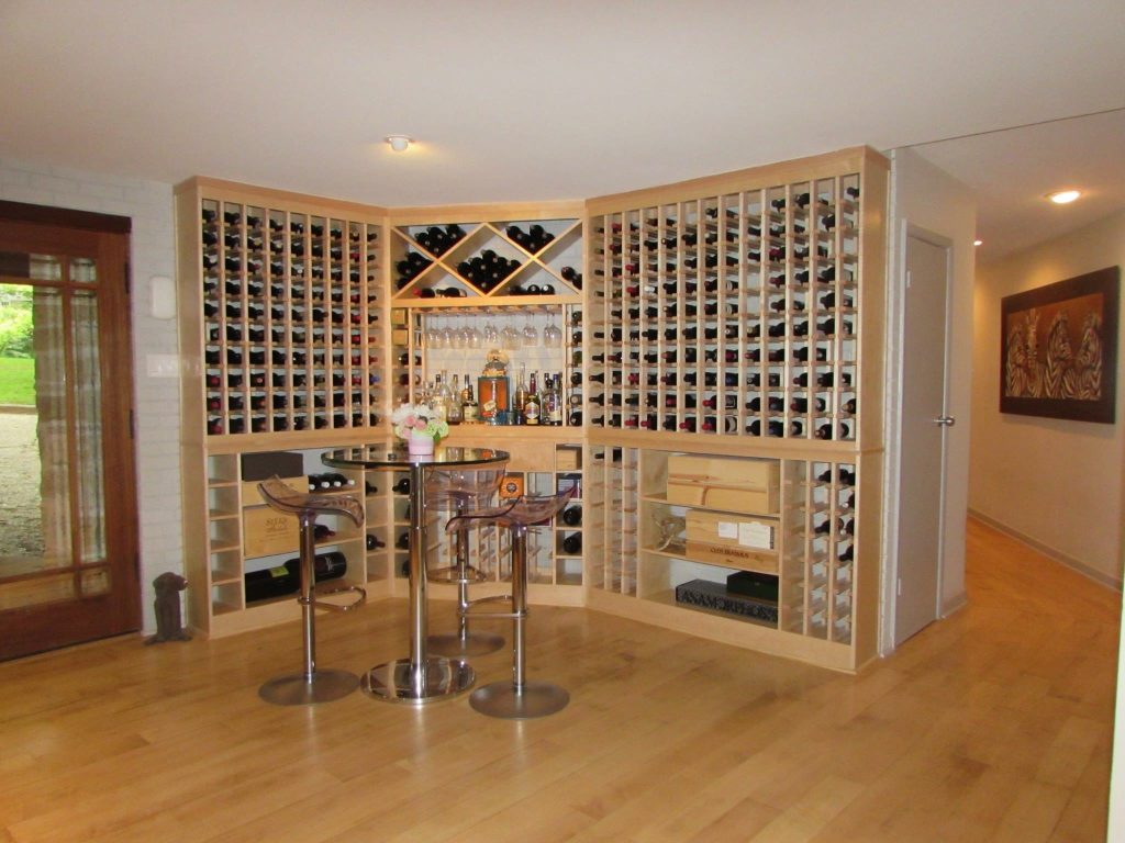 Custom wine room with floor-to-ceiling bottle storage and a central table