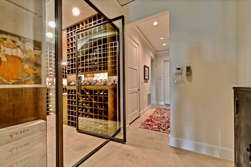 Glazed wine room with floor-to-ceiling racks