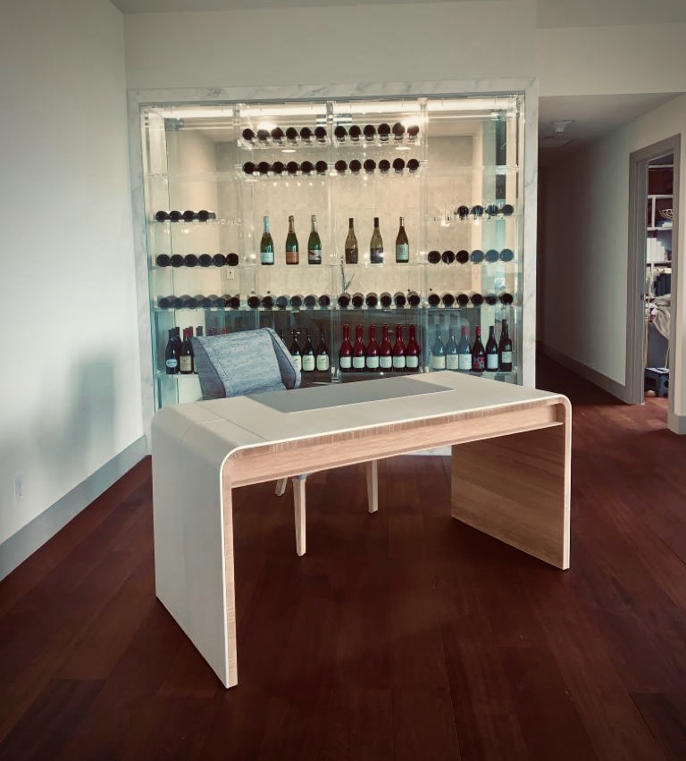 Glass-front wine display with illuminated bottle storage