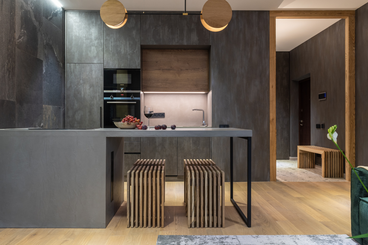 A beautiful kitchen with gray walls tables