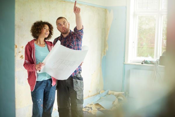 Man pointing out a problem of the house.