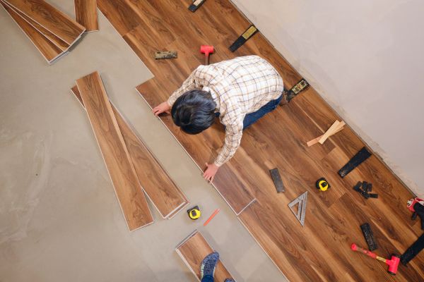 Worker assembling flooring.