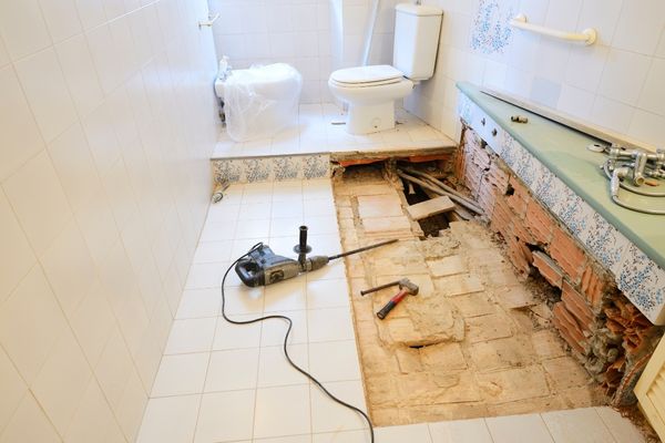 Bathroom remodeling in progress with equipment
